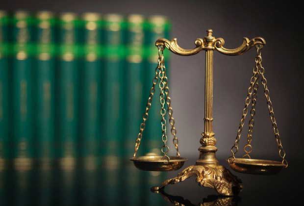 Scales of justice with law books